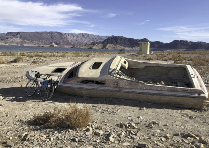 a boat abandoned on land due to a declining lake mead